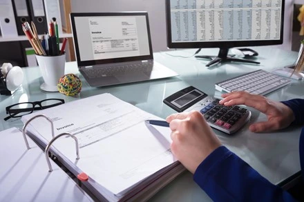 Healthcare payment posting and reconciliation specialist reviewing financial records, insurance payments, and reimbursement data for accurate medical billing management